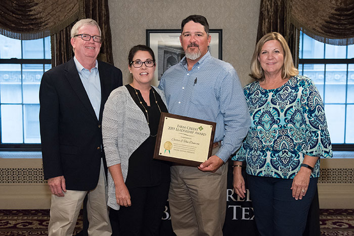 Toni and Carter Damron (center) pictured with Farm Credit Bank of Texas directors Jack Dailey, left, and Linda Floerke.
