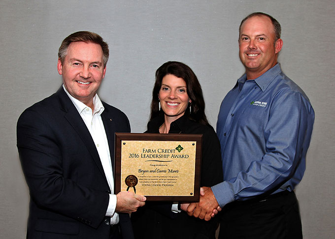 Carrie and Bryan Morris, right, of De Leon, Texas, attended the 2016 Farm Credit Young Leaders Program on behalf of Central Texas Farm Credit. They celebrated the completion of the program in Washington, D.C., with Stan Ray, left, Farm Credit Bank of Texas chief administrative officer and Tenth District Farm Credit Council president.